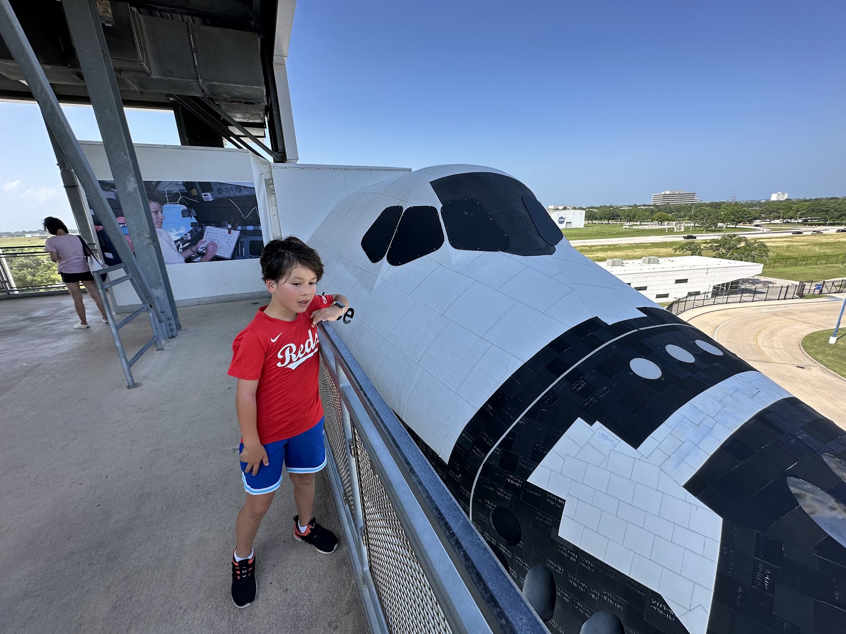 Standing in front of Space Shuttle