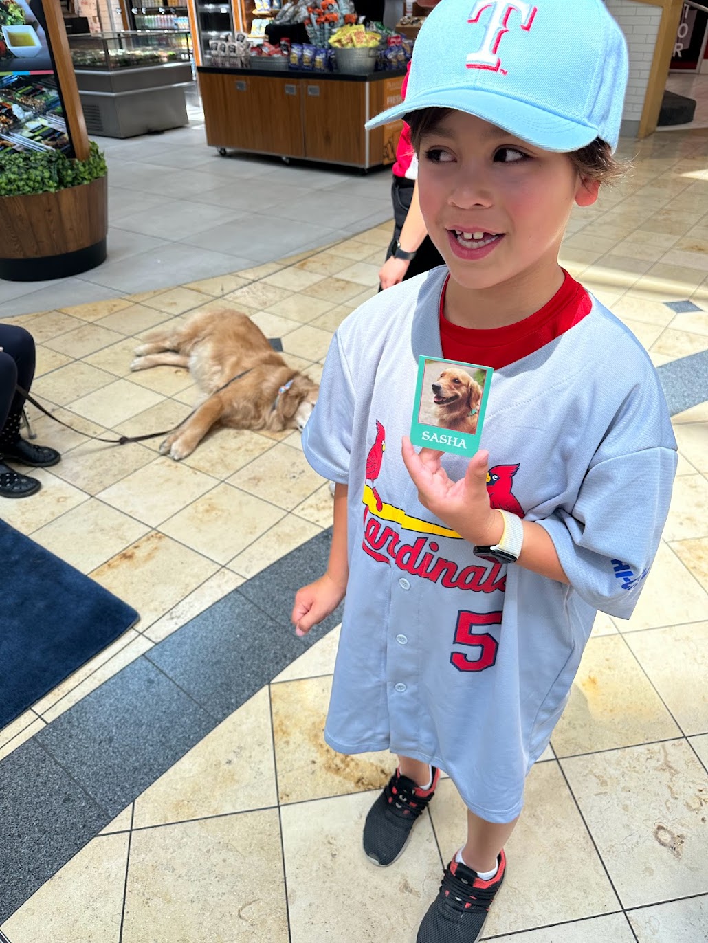 me with “Sasha” the therapy dog at Minneapolis Airport